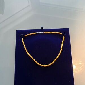 Woman’s Fred jewelry necklace 14 1/2 inch color, yellow silk 18 karat gold solid